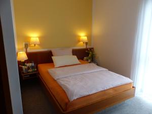 Ein Bett oder Betten in einem Zimmer der Unterkunft Hotel Dorotheenhof