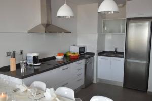 A kitchen or kitchenette at Aqua Nature 27D