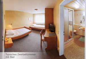 Giường trong phòng chung tại Hotel Keinath Stuttgart