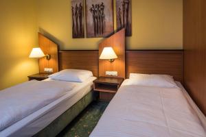 Letto o letti in una camera di Hotel Sperling mit E-Ladestation