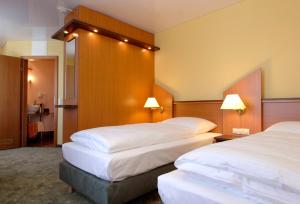 Letto o letti in una camera di Hotel Sperling mit E-Ladestation
