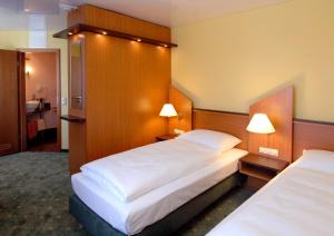 Letto o letti in una camera di Hotel Sperling mit E-Ladestation