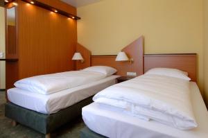 Letto o letti in una camera di Hotel Sperling mit E-Ladestation