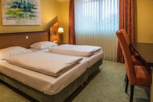 Letto o letti in una camera di Hotel Sperling mit E-Ladestation