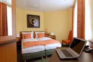 Letto o letti in una camera di Hotel Sperling mit E-Ladestation