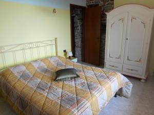 En eller flere senge i et værelse på Agriturismo Cascina Serra