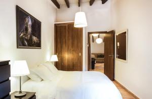 Postel nebo postele na pokoji v ubytování Petit Hotel Alaro
