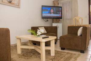 TV a/nebo společenská místnost v ubytování Cypa Hotel