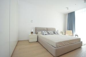 Кровать или кровати в номере Leona Residences Apartment
