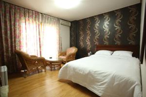 Postel nebo postele na pokoji v ubytování Namwon Hotel
