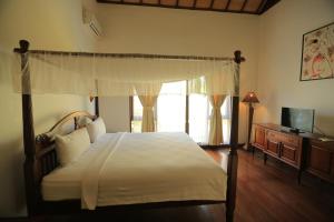 Cama o camas de una habitación en Putri Bali Villa