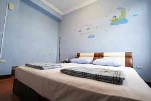 Llit o llits en una habitació de 驫風民宿 Equuleus Homestay