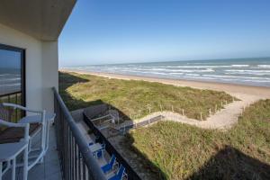 a balcony with a view of the beach at Florence in South Padre Island