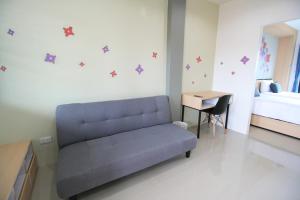 Area soggiorno di Sirimunta Hotel Chiang Rai Suite & Residence