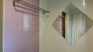 a bathroom with a walk in shower and a mirror at Baan Baimai Boutique Room in Phra Nakhon Si Ayutthaya +37 photos