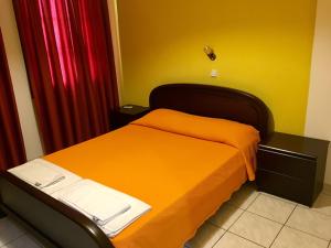 Ένα ή περισσότερα κρεβάτια σε δωμάτιο στο Argo Apartments