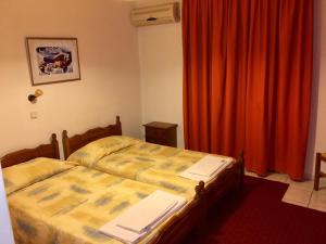 Postel nebo postele na pokoji v ubytování Argo Apartments