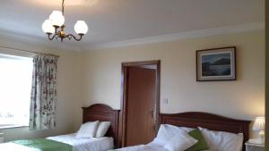 Postel nebo postele na pokoji v ubytování Achill West Coast House