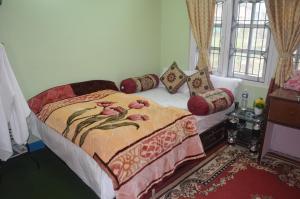 Tempat tidur dalam kamar di Dahachok Homestay