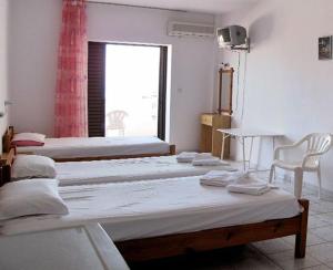 Postel nebo postele na pokoji v ubytování Skentos Hotel + 22 fotografií