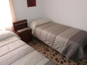 Postel nebo postele na pokoji v ubytování Alojamiento Familiar Conde Don Ramon