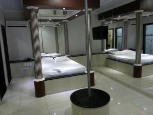 En eller flere senge i et værelse på Shopping Motel Santa Maria do Pará