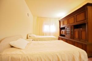 Postel nebo postele na pokoji v ubytování Hotel Class
