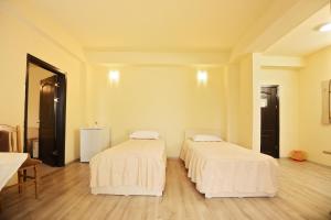 Postel nebo postele na pokoji v ubytování Hotel Class
