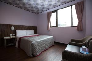 Letto o letti in una camera di Sofu Hotel