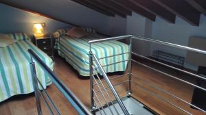 A bed or beds in a room at Apartamentos Santana