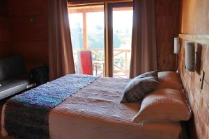 Voodi või voodid majutusasutuse Hostal Boutique Los Arrayanes toas