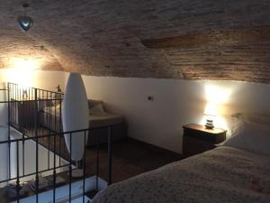 A bed or beds in a room at Casa Vacanze Piazza Vecchia