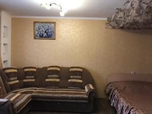 Кровать или кровати в номере Apartment ob Stroitelei 20