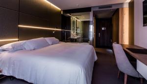 Cama o camas de una habitación en Hotel & Spa Ciudad de Binéfar