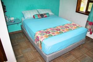 Postel nebo postele na pokoji v ubytování Yaxche Centro Hostal y Camping
