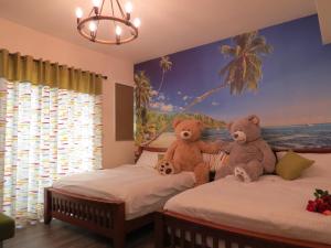 Postel nebo postele na pokoji v ubytování Hai Yang Homestay
