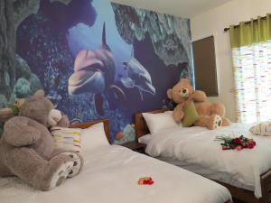 Postel nebo postele na pokoji v ubytování Hai Yang Homestay
