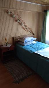 Säng eller sängar i ett rum på "Mi Hostal Tu Casa" Hostal Familiar SOLO EMPRESAS, TURISTAS y VIAJEROS