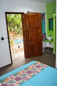 Postel nebo postele na pokoji v ubytování Yaxche Centro Hostal y Camping