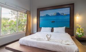 Postel nebo postele na pokoji v ubytování Krabi Home Town Boutique