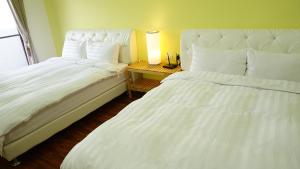 A bed or beds in a room at Warm Home