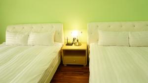 A bed or beds in a room at Warm Home