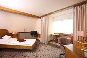 TV a/nebo společenská místnost v ubytování Hotel Brielhof