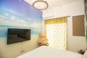 TV a/nebo společenská místnost v ubytování Hai Yang Homestay