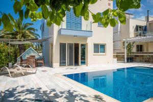 an image of a villa with a swimming pool at Coralli Villas in Coral Bay