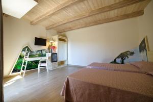A bed or beds in a room at Agriturismo Frantoio Mafrica