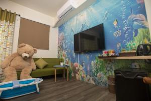 TV a/nebo společenská místnost v ubytování Hai Yang Homestay