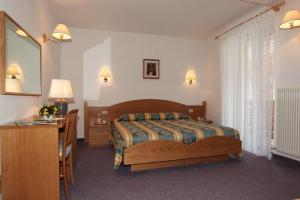 Postel nebo postele na pokoji v ubytování Hotel Garnì Villanova