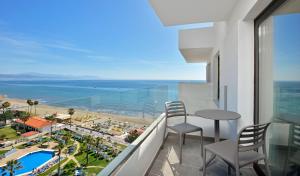 a view from a balcony overlooking the ocean at Sol House Costa del Sol in Torremolinos