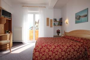 Postel nebo postele na pokoji v ubytování Hotel Garnì Villanova